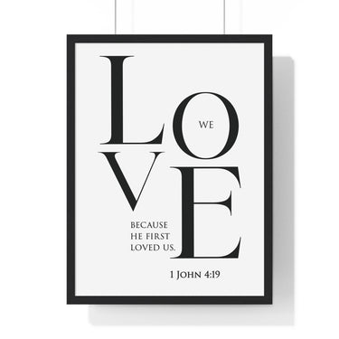 We Love framed Bible verse wall art inspired by 1 John 4:19, black frame with black and white scripture typography
