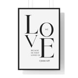 We Love framed Christian wall art inspired by 1 John 4:19, black frame with black and white scripture typography