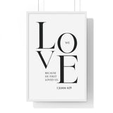 We Love framed Christian wall art inspired by 1 John 4:19, white frame with black and white scripture typography