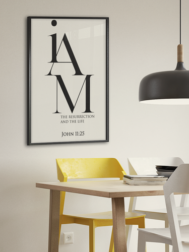 Dining room with a table, chairs, and a framed poster on the wall.
